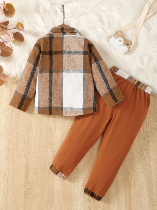 children's two-piece outfit with a button up color block top and matching pants displayed on flat neutral lighting
